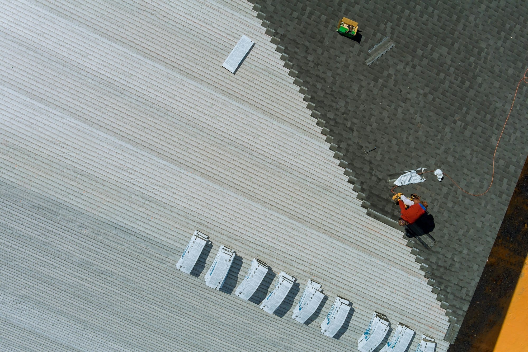 Roof installing asphalt shingles with new shingles of an building